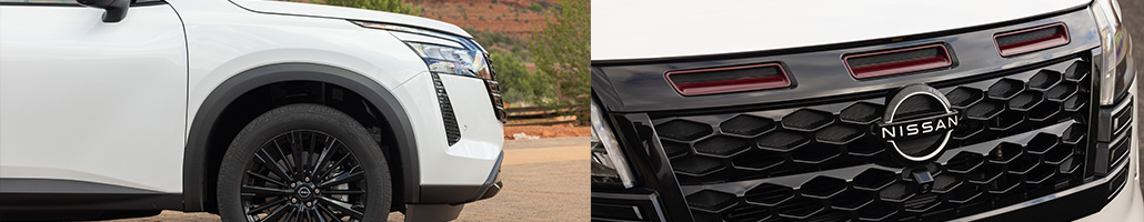 Détails de la roue noire et de la calandre du Nissan Pathfinder blanc.