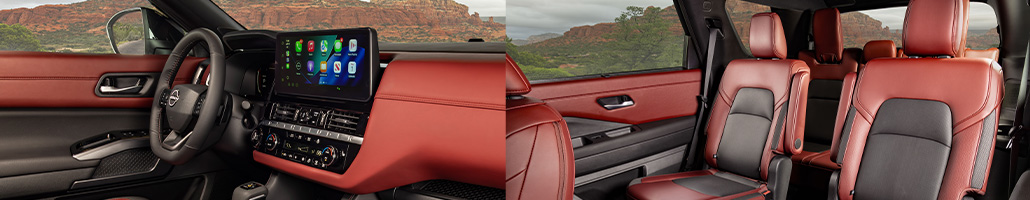 Tableau de bord et sièges noirs et bourgogne du Nissan Pathfinder.